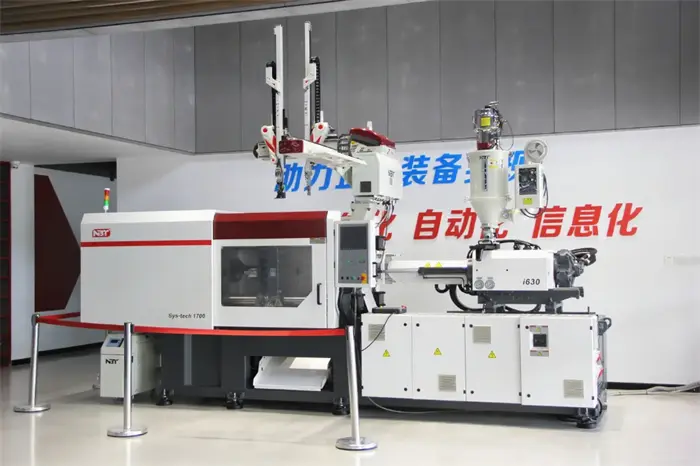 Robotic arms for injection molding removing parts from a mold